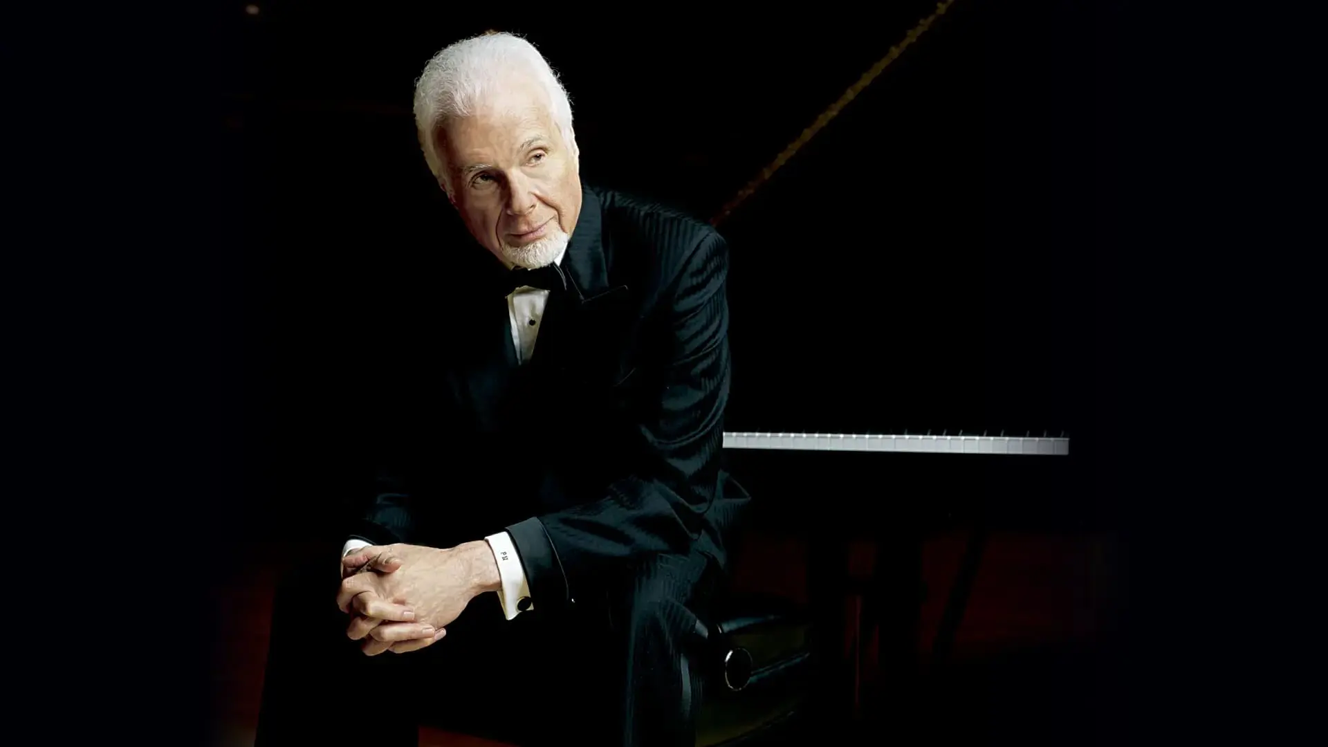 Peter Nero sitting on a piano bench. Peter Nero sitting on a piano bench.